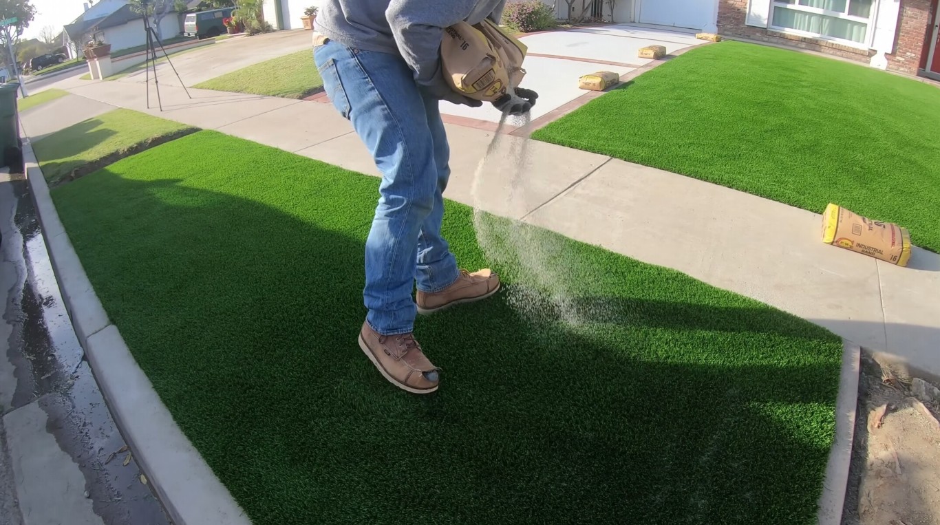 Artificial grass installation process in Southaven, MS showing professional technique
