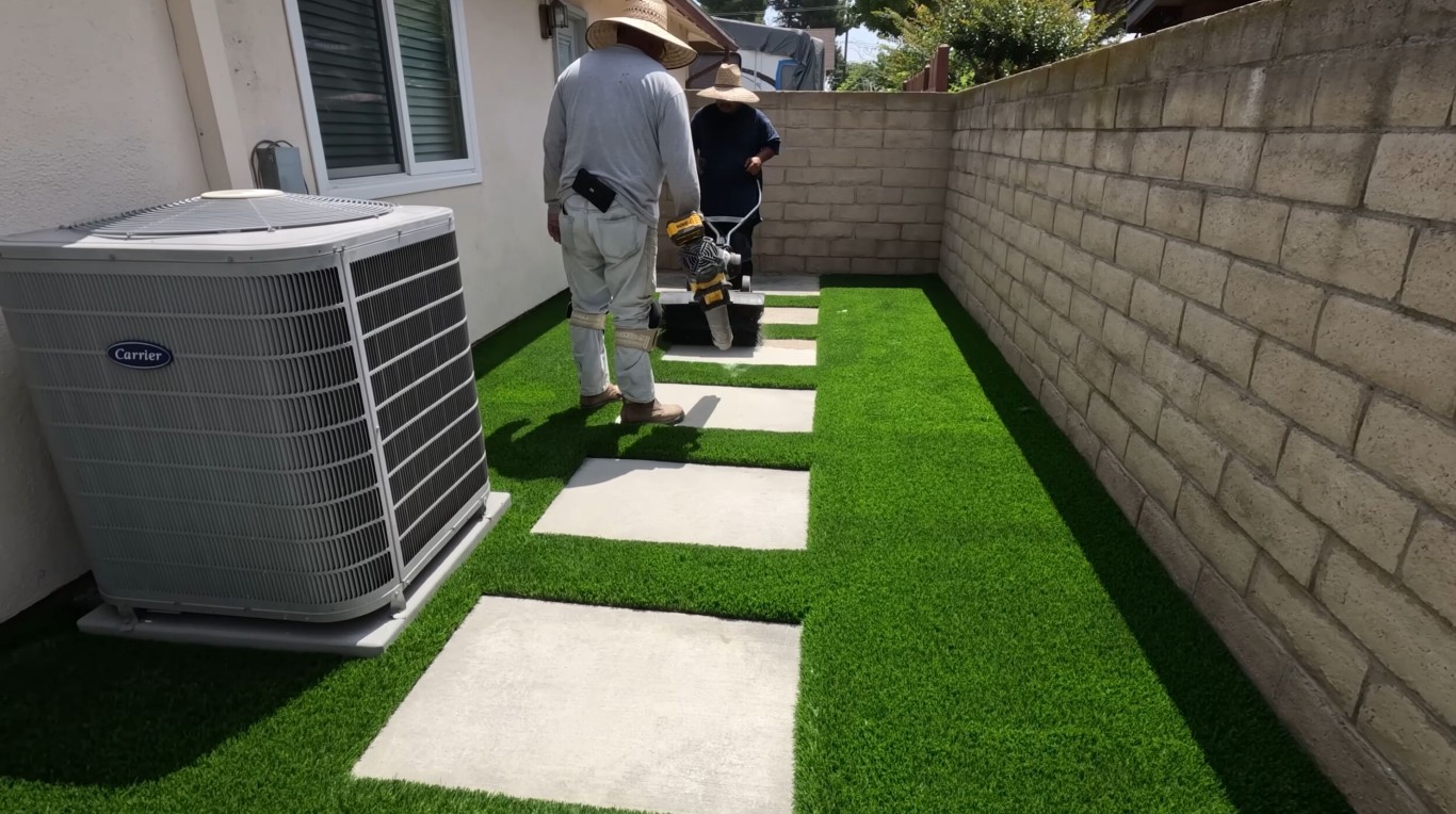 Commercial artificial grass installation with pavers in Southaven, MS
